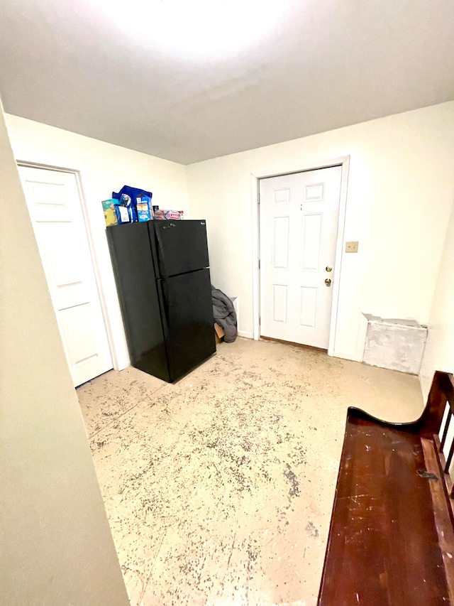 kitchen with black refrigerator