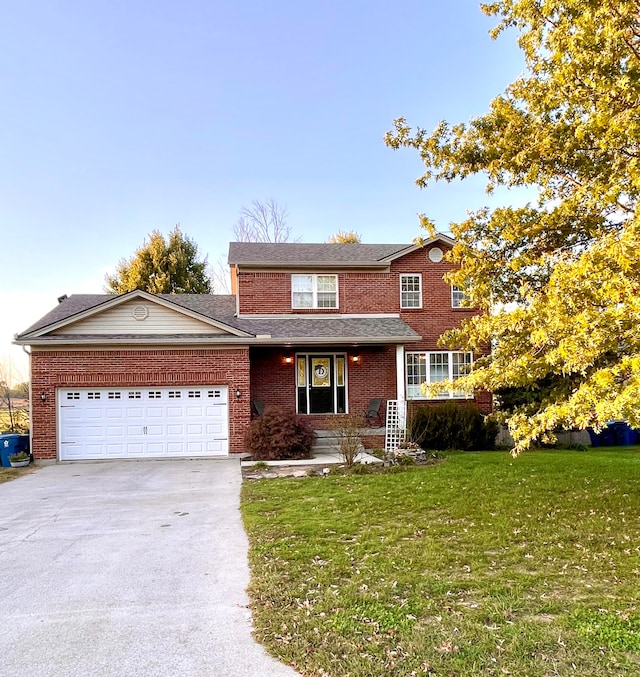 view of front facade with a front yard and a garage