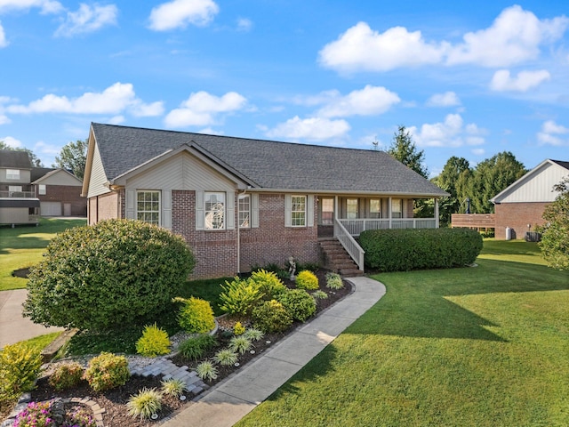 ranch-style house featuring a front yard