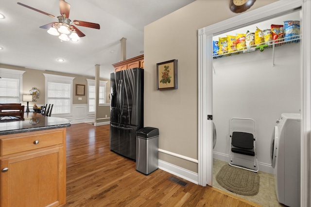 kitchen featuring stainless steel fridge with ice dispenser, ceiling fan, and wood-type flooring