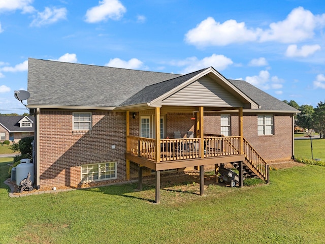 back of property with a lawn and a deck