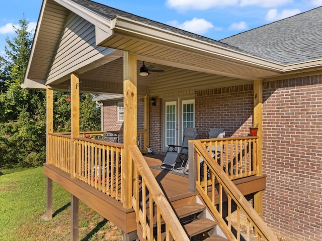 wooden deck featuring ceiling fan