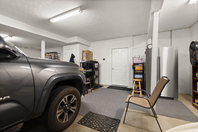 garage featuring stainless steel fridge