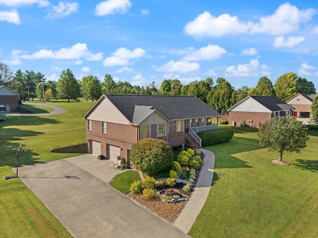 view of front facade with a front yard and a garage