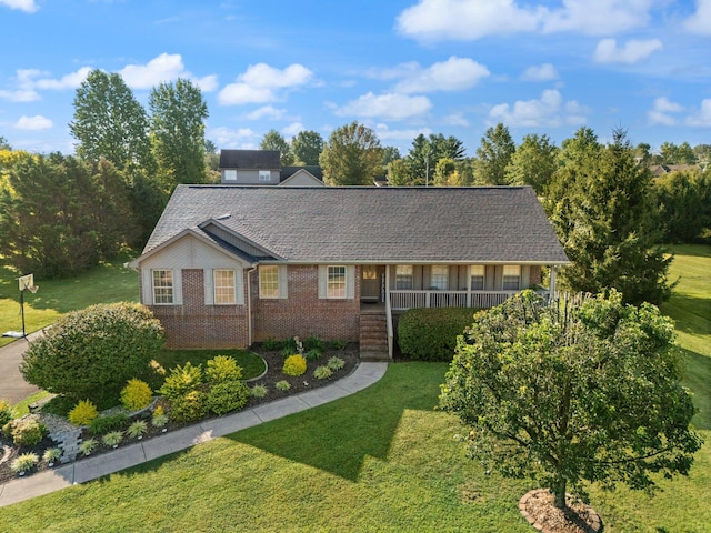 single story home with a front yard and covered porch