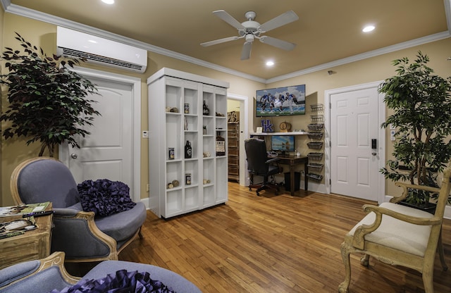 office area featuring a wall mounted air conditioner, ceiling fan, ornamental molding, and hardwood / wood-style flooring