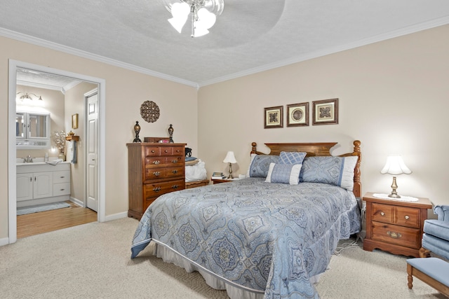 bedroom featuring ceiling fan, crown molding, light carpet, sink, and ensuite bath