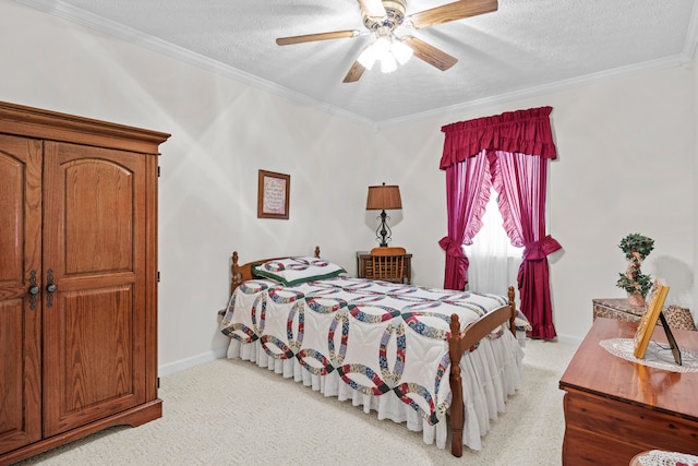 carpeted bedroom featuring crown molding, ceiling fan, and a textured ceiling