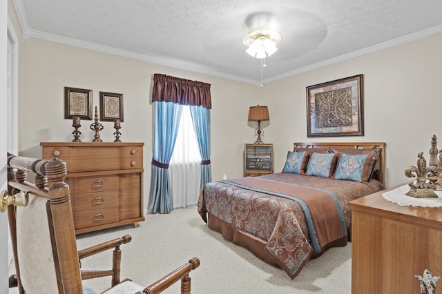 bedroom featuring ornamental molding, light carpet, and a textured ceiling