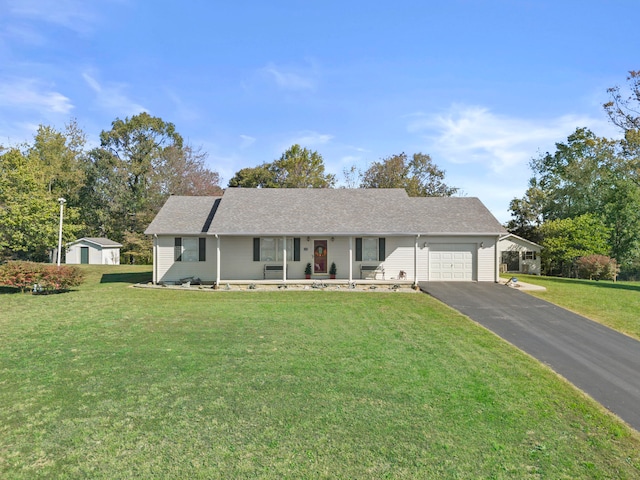 single story home featuring a front yard, a garage, and covered porch