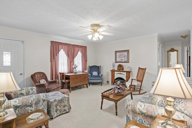 living room with carpet flooring, a textured ceiling, ornamental molding, and ceiling fan
