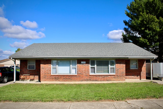 single story home featuring a front yard