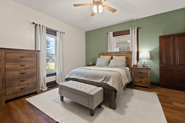 bedroom featuring dark hardwood / wood-style flooring and ceiling fan