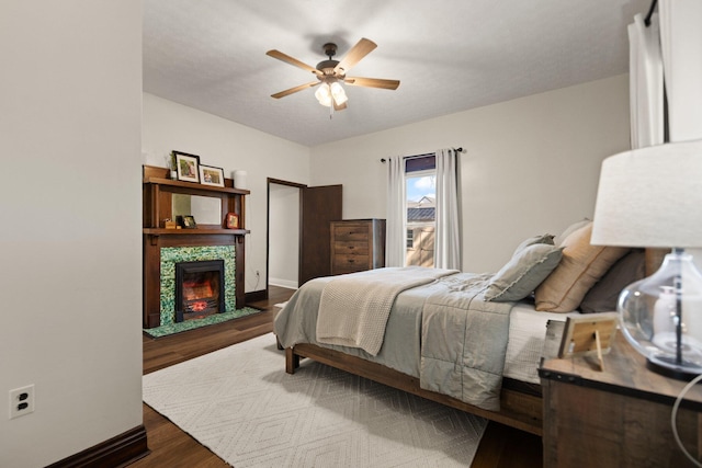 bedroom featuring ceiling fan and wood-type flooring