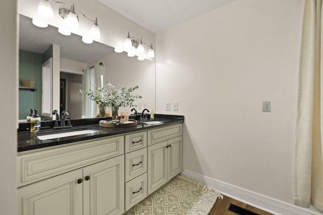 bathroom featuring vanity and wood-type flooring