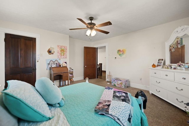 bedroom with dark colored carpet and ceiling fan