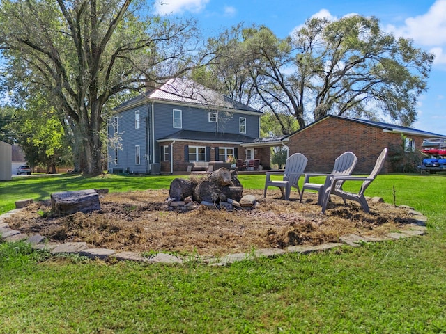 rear view of house with a lawn