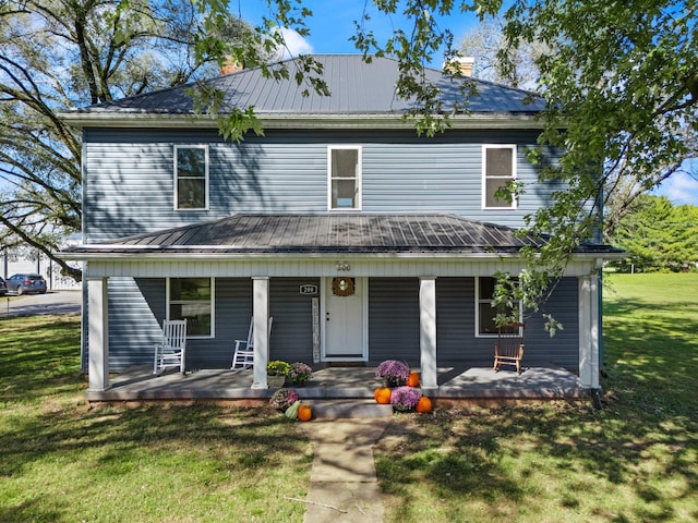 view of front facade with a porch and a front yard