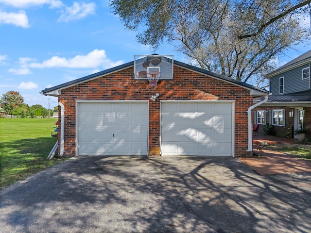 garage featuring a lawn