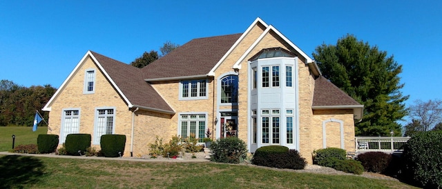 view of front facade with french doors and a front yard