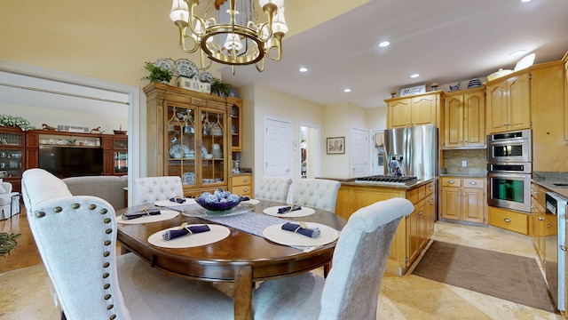 dining area featuring a chandelier