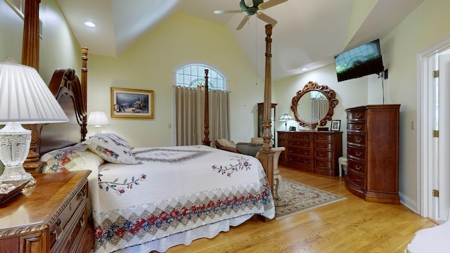 bedroom featuring lofted ceiling, light wood-type flooring, and ceiling fan