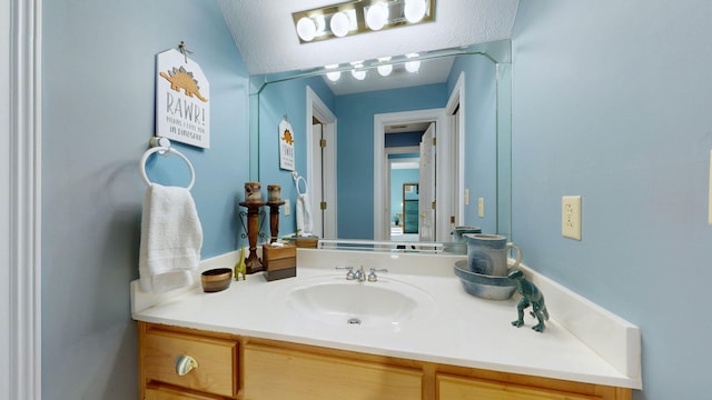 bathroom featuring vanity and a textured ceiling