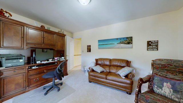 office area with light carpet and built in desk