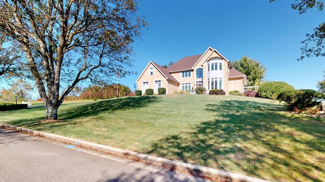 view of front of home with a front lawn