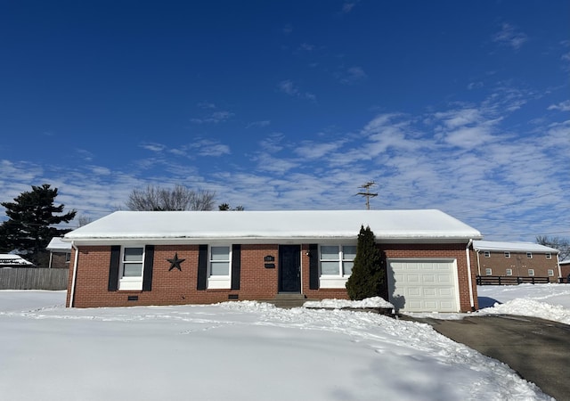 ranch-style home with a garage