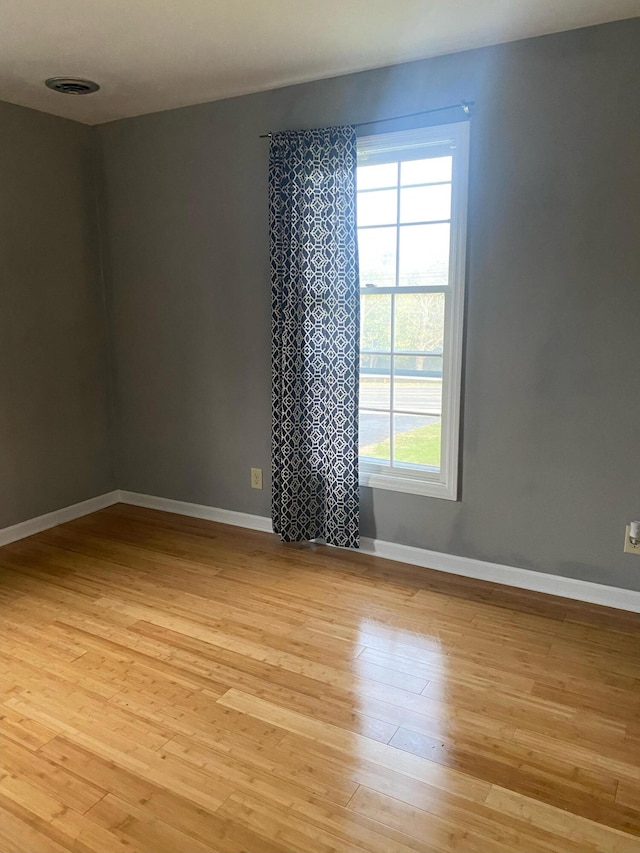 spare room featuring light hardwood / wood-style floors