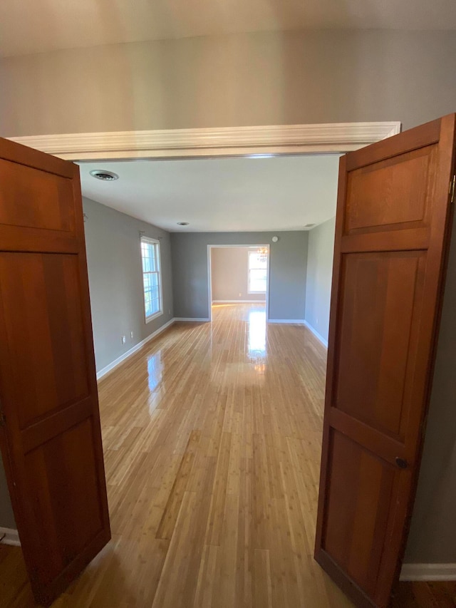 unfurnished room with light hardwood / wood-style flooring