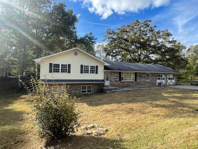 split level home with a front yard