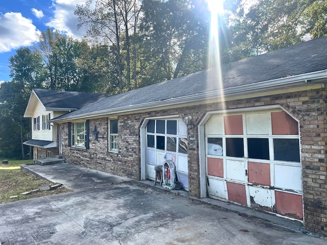 view of side of property featuring a garage