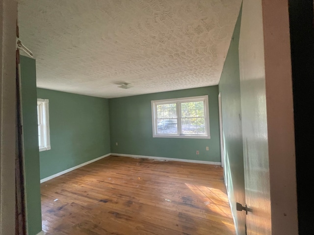 empty room with wood-type flooring