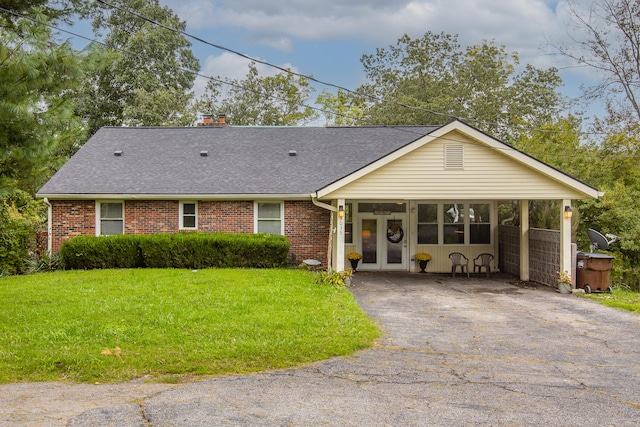 ranch-style home with a front yard