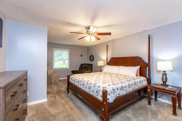 bedroom featuring ceiling fan and light colored carpet