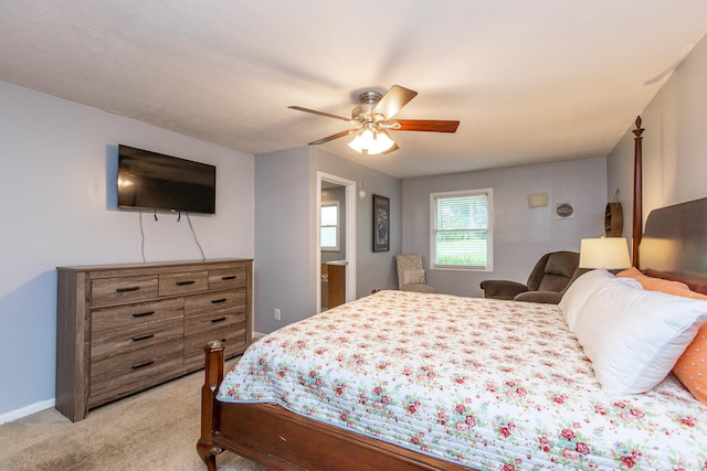 bedroom with light colored carpet and ceiling fan