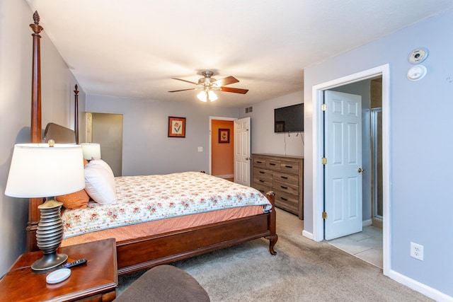 bedroom featuring light carpet and ceiling fan