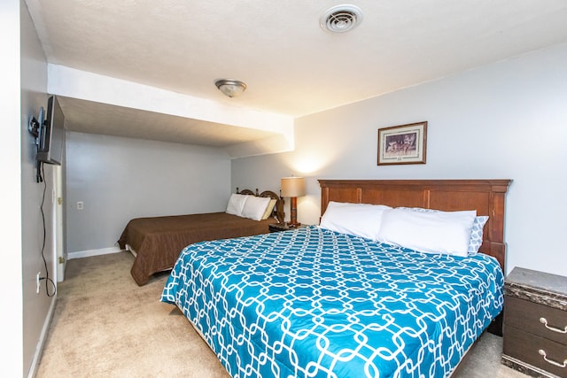 bedroom featuring light colored carpet