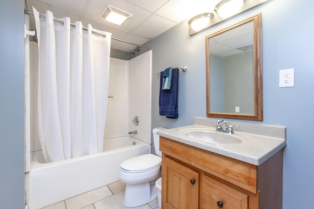 full bathroom with tile patterned floors, toilet, shower / tub combo, vanity, and a paneled ceiling