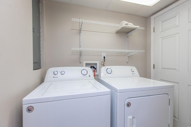 clothes washing area with washer and clothes dryer