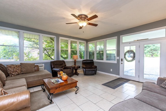 tiled living room featuring ceiling fan