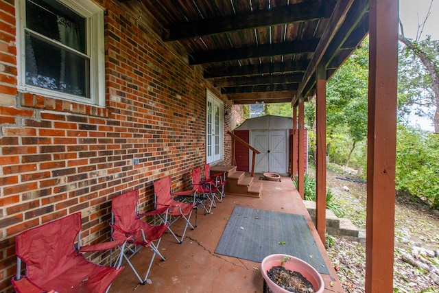 view of patio featuring a storage unit