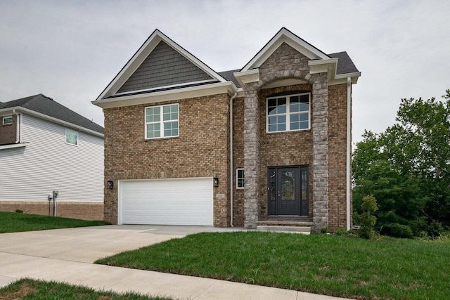 view of front of home featuring a front lawn and a garage