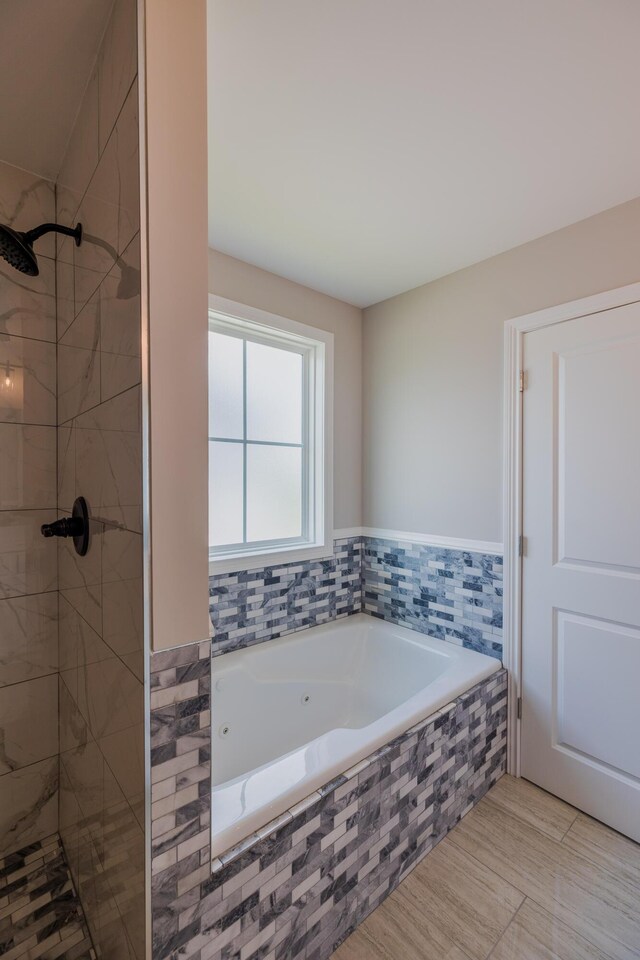 bathroom featuring vanity, a bathtub, and toilet