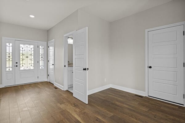 entrance foyer with baseboards, recessed lighting, wood finished floors, and visible vents