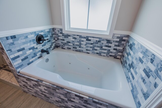 bathroom featuring tiled shower