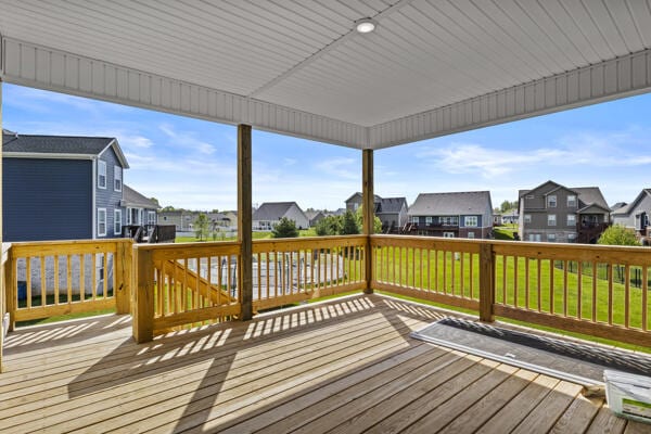 wooden terrace featuring a residential view