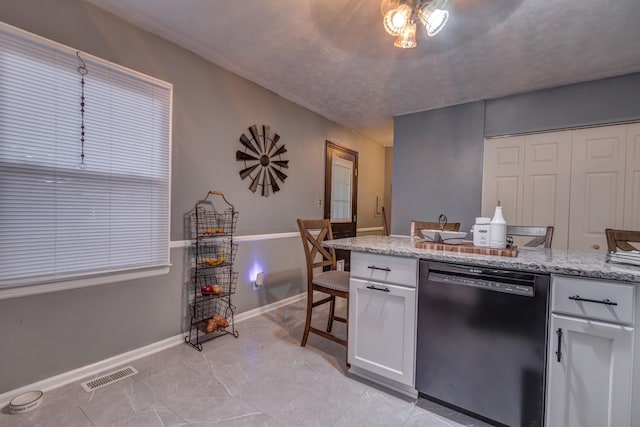 kitchen featuring white cabinetry, light stone counters, dishwasher, and ceiling fan